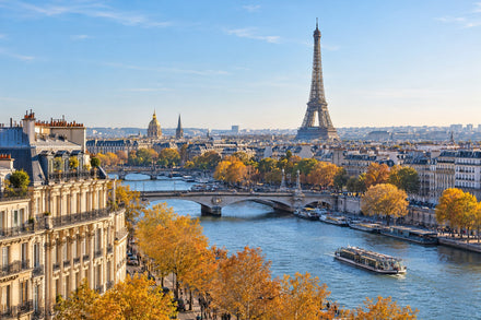 Paris skyline and the Eiffel Tower above the Seine in bright autumn light