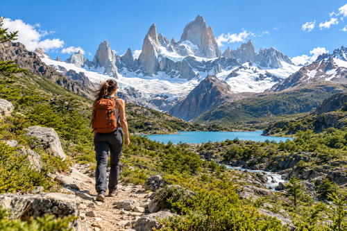 Backpacker on a trail near El Chaltén with the granite peaks of Fitz Roy in Argentina